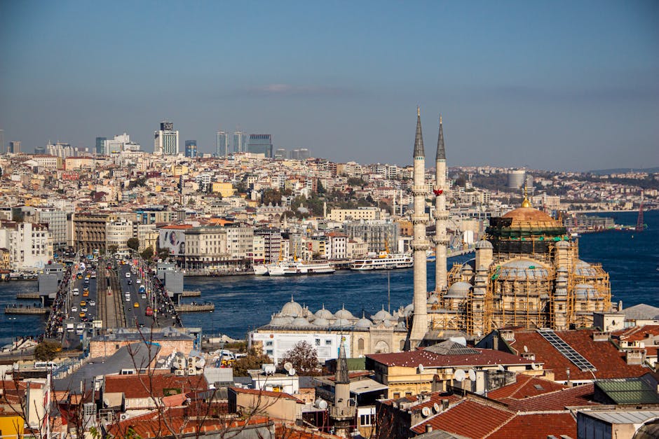 A stunning aerial view of Istanbul featuring the Galata Bridge, a mosque, and the vibrant cityscape.