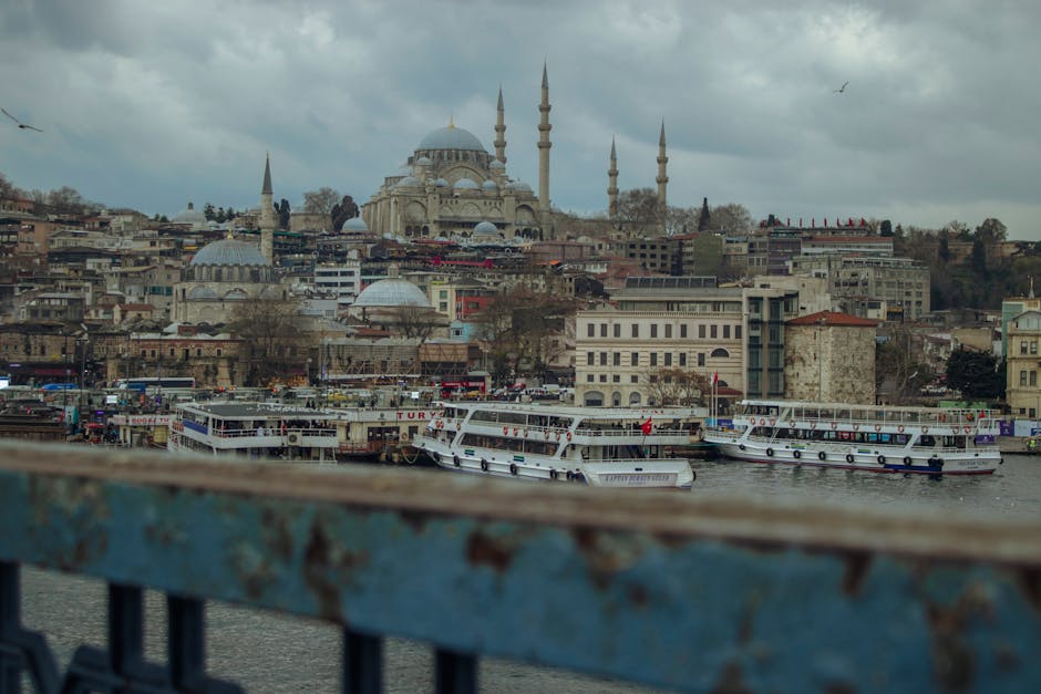 Scenic view of Istanbul's skyline, highlighting iconic mosques and bustling waters.